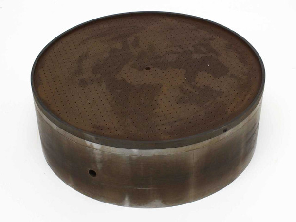OS Walker AXM-13973-1 20-inch round vacuum chuck — angled top view showing perforated surface face with significant surface rust and side wall with vacuum port hole