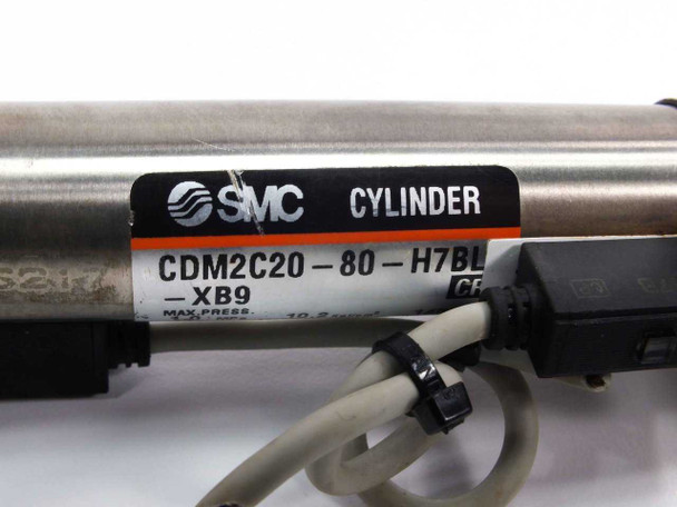 SMC CDM2C20-80-H7BL-XB9 cylinder label closeup showing model number, max pressure rating, and SMC branding