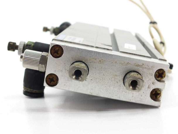 Koganei CS-TBDA16x100 pneumatic cylinder – side/bottom view showing port connections, mounting screws, and elbow fitting