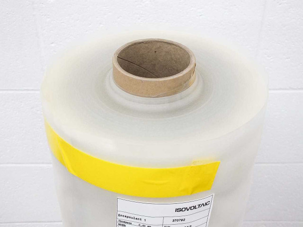 Top view of Isovoltaic 370792 encapsulant film roll showing cardboard core and Isovoltaic product label with yellow tape band