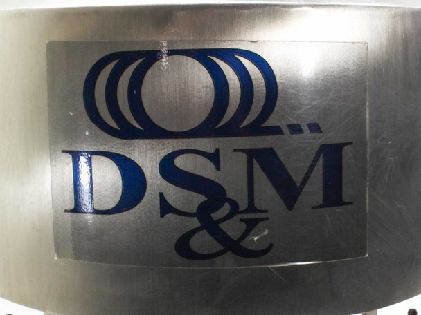 Close-up of DSM brand logo decal on stainless steel hopper body