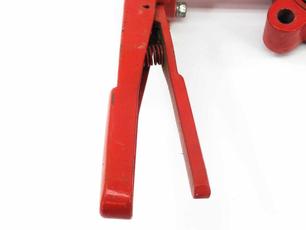 Close-up of Bray lever lock handle fork and locking spring detail showing paint wear and spring mechanism