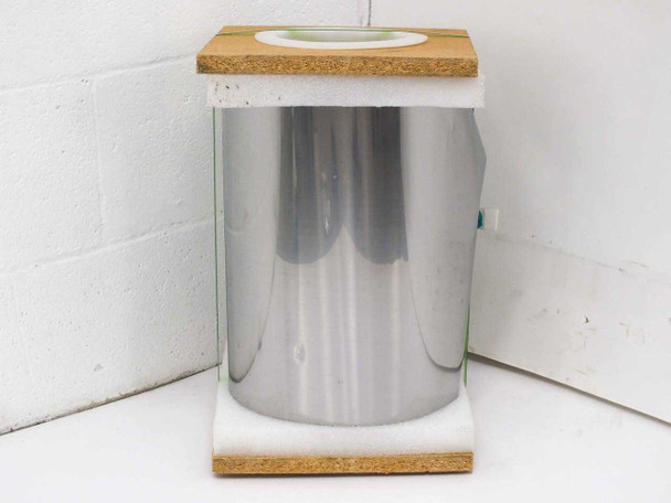 Hamilton Precision Metals SS 430 stainless steel roll mounted on display spool with particleboard top and base, bright mirror-finish strip visible