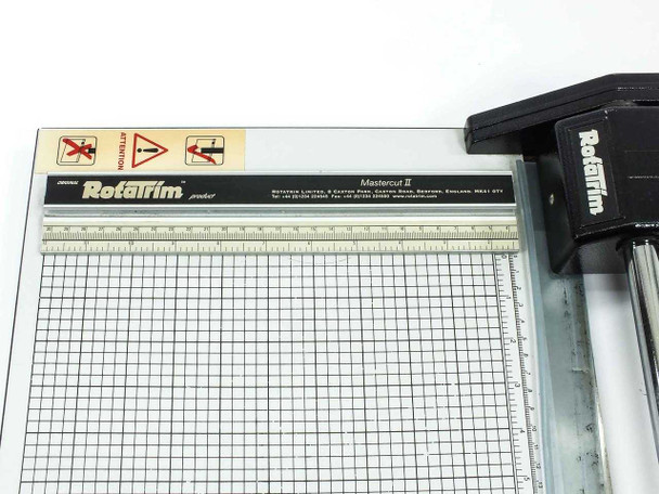 Rotatrim Mastercut II cutting head detail and ruler guide rail — close-up top view