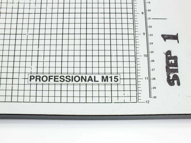 Rotatrim Professional M15 model label close-up on cutting table grid