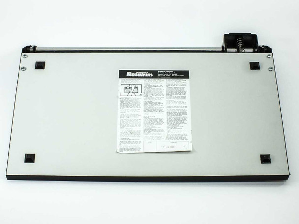 Rotatrim Professional M15 paper trimmer — underside view with rubber feet and instruction label