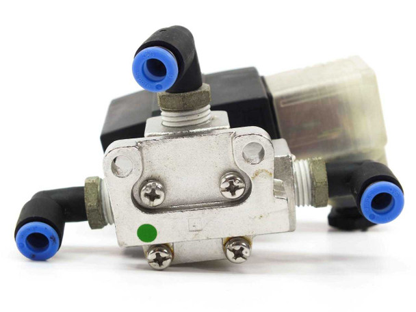 SMC VX3344M solenoid valve — bottom/port view showing two push-in tube fittings and valve body