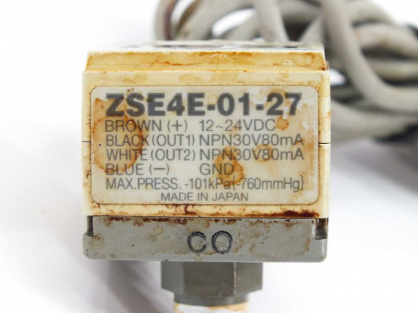 SMC ZSE4E-01-27 label close-up showing model number, wiring diagram, NPN 30V 80mA outputs, 12-24VDC supply, max -101 kPa, Made in Japan