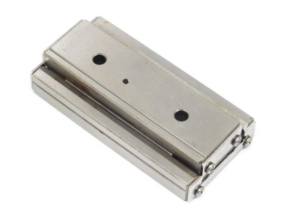 IKO BWU30-60 linear slide table — top-down view showing table surface, two mounting holes, and slide rail assembly