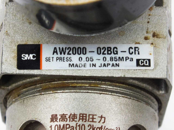 SMC AW2000-02BG-CR label close-up showing model number, set pressure 0.05–0.85 MPa, and Made in Japan marking