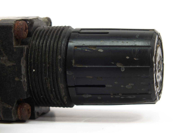 SMC AW2000-02BG-CR regulator knob close-up showing wear and surface scuffing