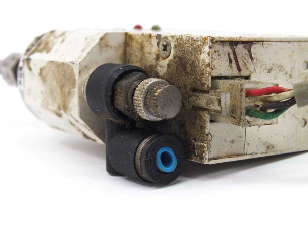 Koganei DTRY-ELB01 rear/side view showing pneumatic push-in fitting, threaded air port, and internal wiring