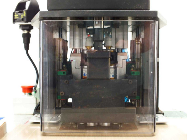 Misco MX1-710-000-2 – close-up of four-punch head assembly behind clear acrylic guard showing SMC cylinders on HIWIN linear slides