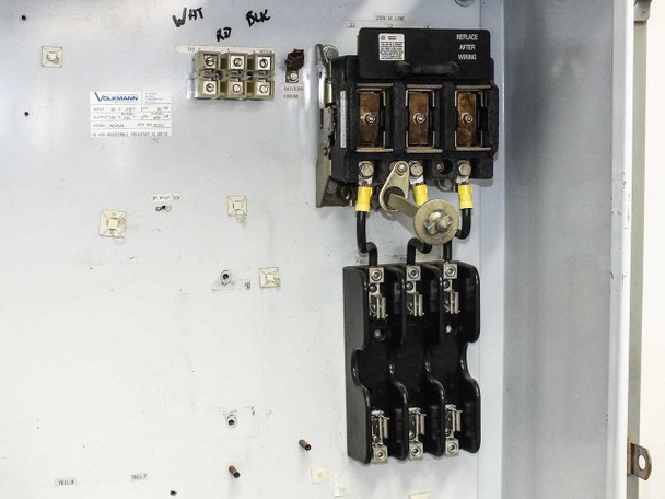 Hammond 1418 T12 interior disconnect closeup – 3-pole disconnect/fuse block with Volkmann label, yellow wire end covers, WHT RD BLK wire markings on backplate