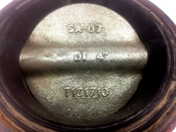 Nibco WD3010 butterfly valve disc close-up showing cast markings: SA-07, DI 4", and cast number T1Q1710