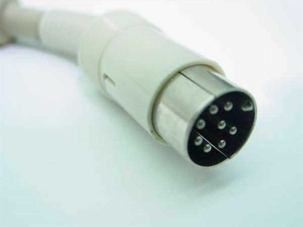 Close-up of 8-pin DIN connector on the end of the coiled keyboard cable