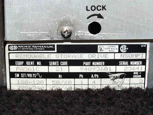 Magnetic Peripherals 94093601 rating plate close-up showing part number, series code 21, equipment ID PA3A1C, serial number, and voltage/current specs