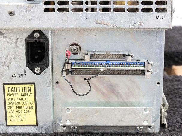 Magnetic Peripherals 94093601 rear panel close-up showing IEC C14 AC input connector J1, 50-pin parallel data interface connector, and FAULT indicator label