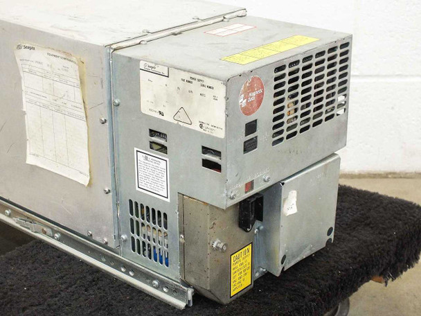 Seagate 81542301 power supply module side view showing rating labels, wiring connector block, and Seagate Technology branding sticker
