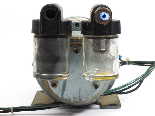 Gast 1531-107B-G288X vacuum pump — front pump-head view showing dual clear oil separator bowls and port fittings