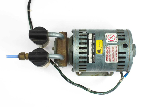 Gast 1531-107B-G288X vacuum pump — top-down view showing pump head, oil separator assembly, blue tubing, warning label, and motor body