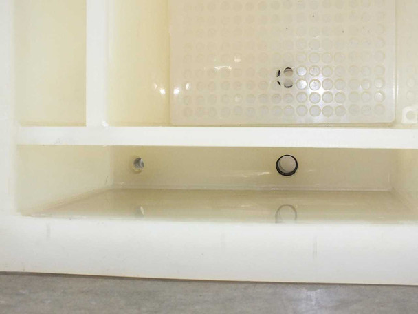 PTFE wafer etch bath interior lower shelf area showing drain fitting and small O-ring fitting detail