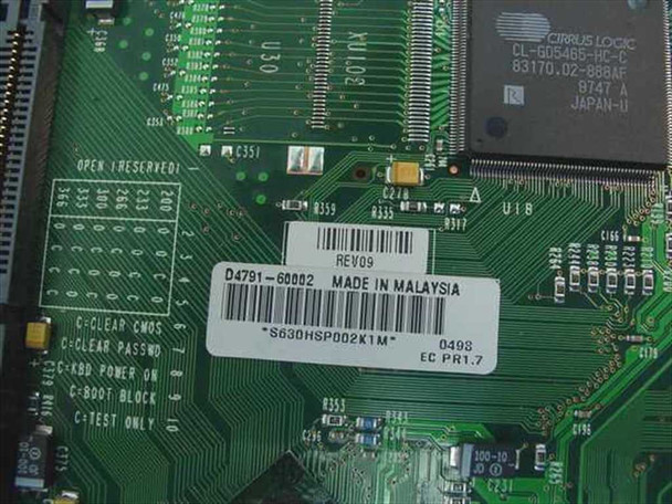 HP D4791-60002 board label close-up showing part number, REV09 revision, Made in Malaysia, and Cirrus Logic CL-GD5465 graphics chip