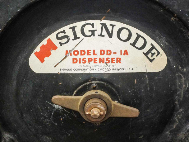 Signode DD-1A dispenser label close-up showing model designation and Signode Corporation Chicago Illinois markings