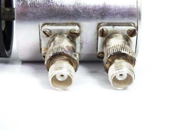 Texscan RA-73 attenuator – close-up of dual SMA female connector ports showing tarnishing and threaded coupling nuts