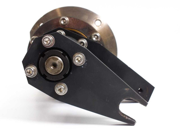 Close-up of black positioning arm and mounting flange end of stainless steel rotation cylinder – front face view
