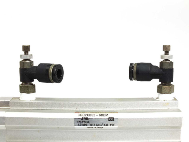SMC CDQ2KB32-60DM-J79L – top view of cylinder body showing push-to-connect fittings and label with model number and specs