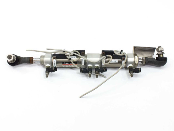 SMC CDM2B32-55 CM2 double acting pneumatic cylinder assembly with rod ends and pneumatic fittings — full unit top view