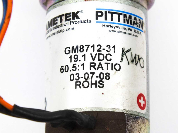 Pittman GM8712-31 label close-up showing 19.1 VDC, 60.5:1 ratio, Ametek branding, and RoHS marking