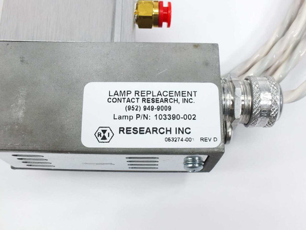 Research Inc label on housing showing Lamp P/N 103390-002, unit number 063274-001 Rev D, with lamp replacement contact info and 1/8 NPT brass fitting