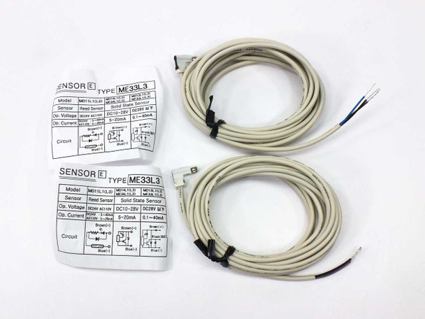 Misumi ME33L3 solid state sensor pair with long pre-wired cables and spec label cards — front view