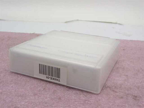 Quantum CompacTape IIIXT bottom view showing barcode label with part number THXKE-01