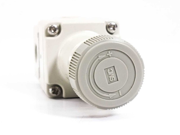 SMC IR1000-N01 Precision Regulator – top-down view showing SMC-branded adjustment knob with plus/minus indicators