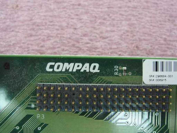 Compaq 296684-001 PCI video card – close-up of PCB edge showing Compaq logo, revision R30 marking, and part number label SP# 296684-001