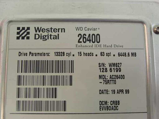 Western Digital WD Caviar 26400 hard drive – drive parameter label showing 13328 cylinders, 15 heads, 63 spt, 6448.6 MB, manufacture date 19 Apr 1999
