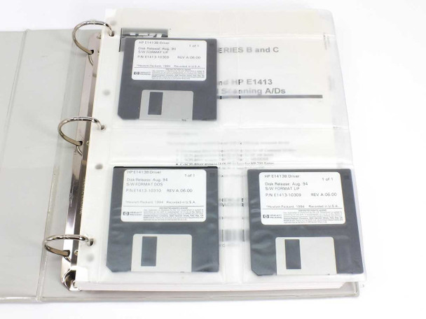 HP E1413 driver floppy disks – three 3.5-inch disks in plastic sleeves inside binder, labels visible