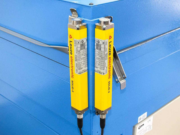Leuze Lumiflex SOLID-2 safety light curtain pair mounted on P Energy L150A laminator – yellow housings with mounting brackets on blue frame corner