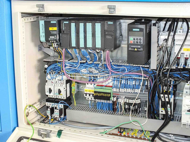 P Energy L150A laminator electrical cabinet closeup – Siemens Simatic S7-300 CPU, digital I/O modules, Micromaster 420 drive, motor starter, and wiring harness