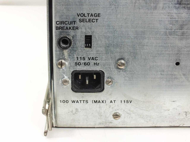 Close-up of rear panel power section on Nicolet 068-7528 — circuit breaker button, voltage select toggle at 115, IEC inlet, and '100 WATTS MAX AT 115V' label