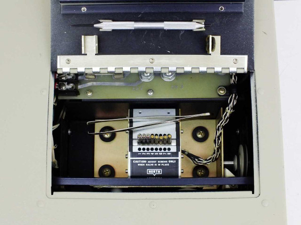 MCR308BTD0X interior top view with lid open — paper drive mechanism, galvo pen carriage, and Nutek pen calibration/adjustment block visible