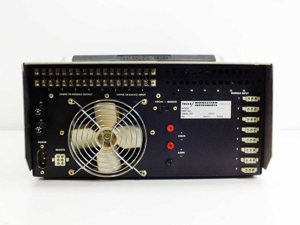 MCR308BTD0X rear panel close-up — Lower TB-Module Output and Upper TB-Galvo Input terminal blocks, large cooling fan, Local/Remote switch, F1/F2 fuse holders, Power and Remote connectors