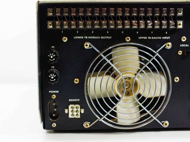 MCR308BTD0X rear panel left section — F1/F2 fuse holders, Power IEC connector, Remote multi-pin connector, Lower TB-Module Output terminal strip, large rear cooling fan with wire guard