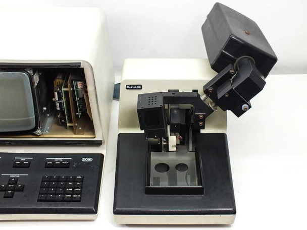 Sloan Dektak IIA VEECO surface profilometer — three-quarter view showing module interface unit (front panel open, internals exposed) and Dektak IIA scan head on stage