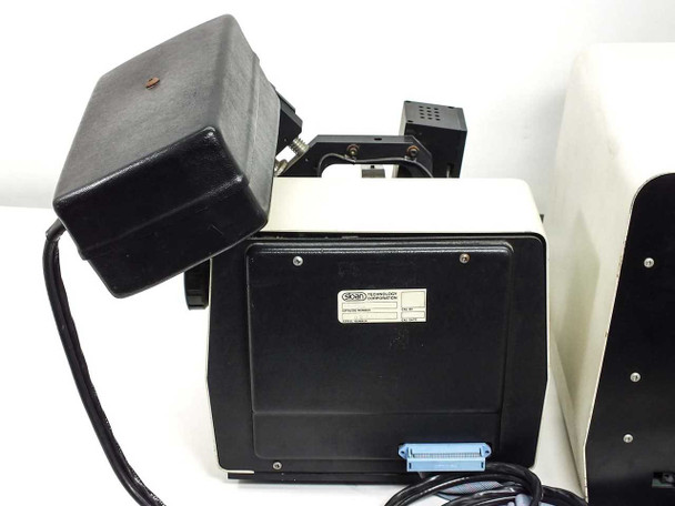 Sloan Dektak IIA scan head — rear label showing Sloan Technology Corporation branding and parallel ribbon connector (blue); scan head assembly partially visible