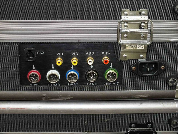 Close-up of Negotiator Console rear panel showing FAX (RJ-11), VID (RCA), AUD (RCA), BUG (RCA), SUSP/COMD/SWAT/LAND/REM VID DIN connectors, and IEC AC inlet