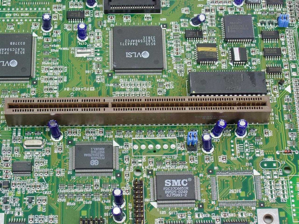 Close-up of ISA expansion slot area on PG4403-04 motherboard showing VLSI and SMC FDC37C651R chips